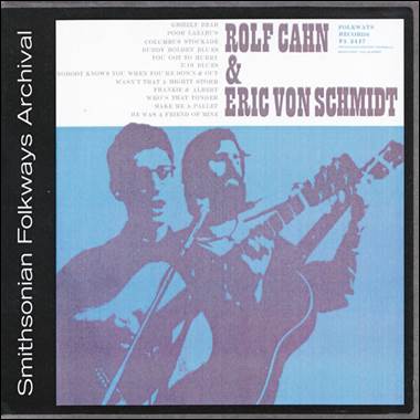 A cd cover with two men playing guitars

Description automatically generated