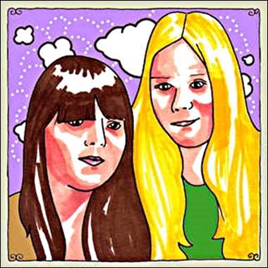 A couple of girls with long hair

Description automatically generated