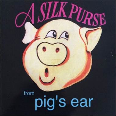 A pig face on a black background

Description automatically generated