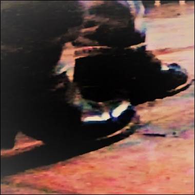 A blurry image of a person's feet

Description automatically generated