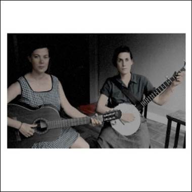 A couple of women playing banjos

Description automatically generated