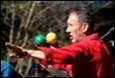 A person juggling balls

Description automatically generated with medium confidence