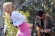 A person in pink skirt and a person playing guitar

Description automatically generated with low confidence