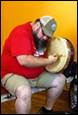 A person playing a drum

Description automatically generated with low confidence
