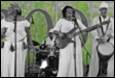 A group of women in white dresses playing instruments

Description automatically generated with low confidence