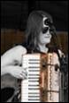 A person playing an accordion

Description automatically generated with medium confidence