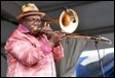 A person playing a trumpet

Description automatically generated with medium confidence