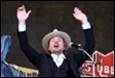 A person in a cowboy hat with his hands up

Description automatically generated with medium confidence