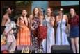 A group of women singing on stage

Description automatically generated