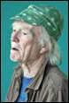 An old person wearing a green hat

Description automatically generated with low confidence