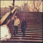 A person and person standing on stairs
Description automatically generated