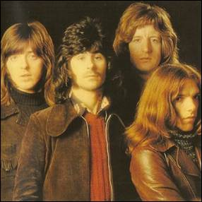 A group of men with long hair
Description automatically generated