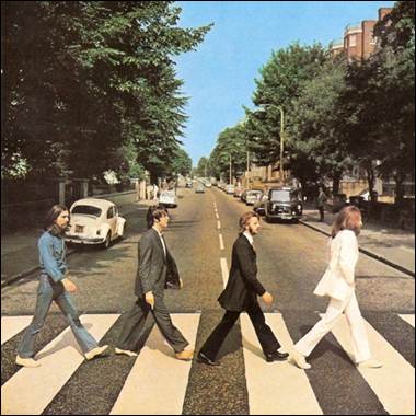 A group of men crossing a street

Description automatically generated