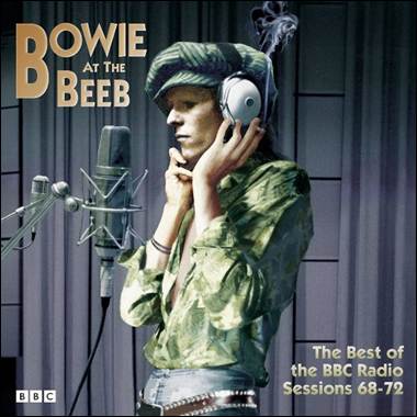 A person wearing headphones and holding a microphone

Description automatically generated