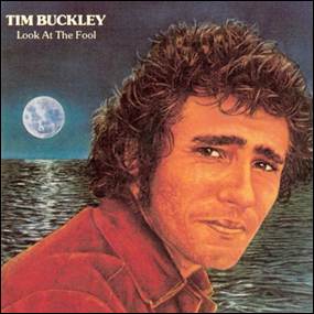A person with curly hair and a moon in the background
Description automatically generated