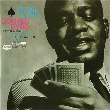 A person holding playing cards

Description automatically generated