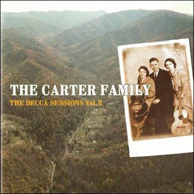 A group of people standing in front of a mountain

Description automatically generated