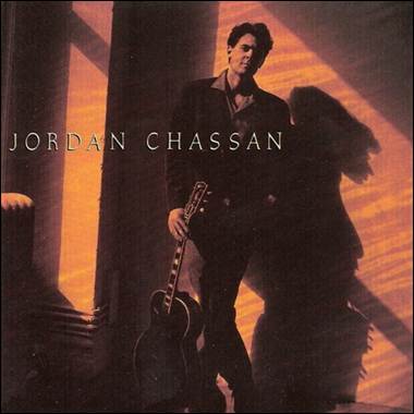 A person holding a guitar

Description automatically generated