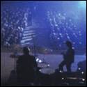A band performing on stage

Description automatically generated