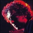 A person with curly hair and red light

Description automatically generated