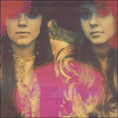 A couple of women with long hair

Description automatically generated