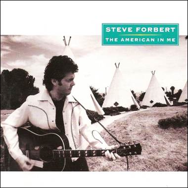 A person playing guitar in front of teepees

Description automatically generated