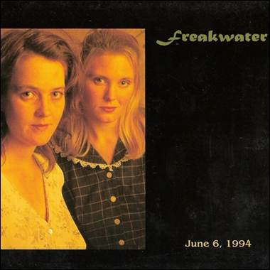 A couple of women posing for a picture

Description automatically generated