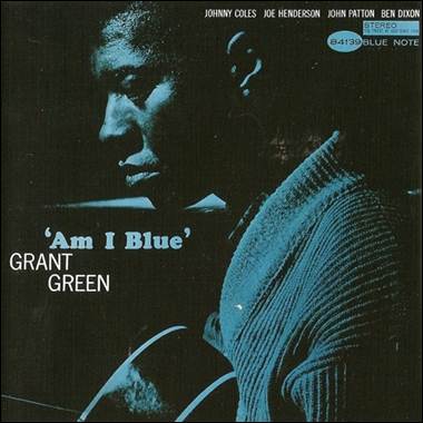 A person in a blue sweater
Description automatically generated