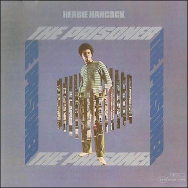 A person standing in front of a cover
Description automatically generated