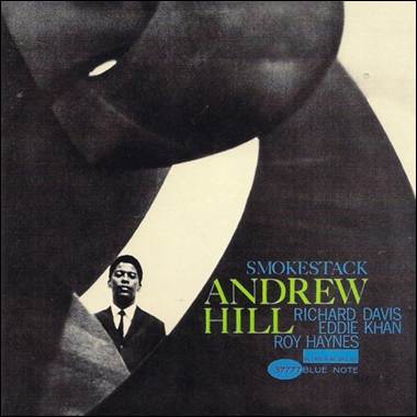 A person standing in front of a sculpture

Description automatically generated