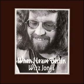 A person with long hair and glasses
Description automatically generated