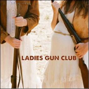 A couple of people holding guns
Description automatically generated