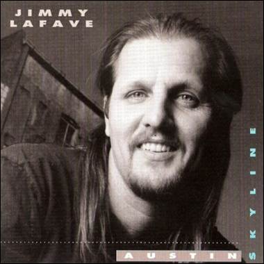 A person with long hair and beard smiling
Description automatically generated