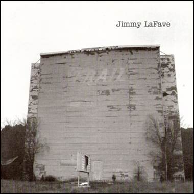 A large building with a sign on the side
Description automatically generated