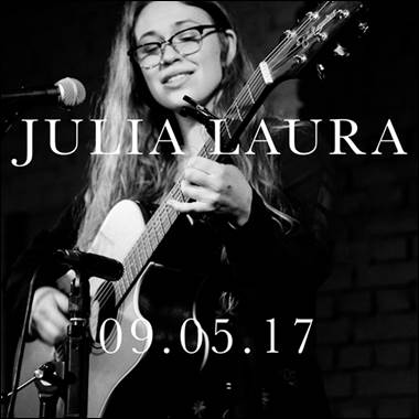 A person playing guitar and singing

Description automatically generated