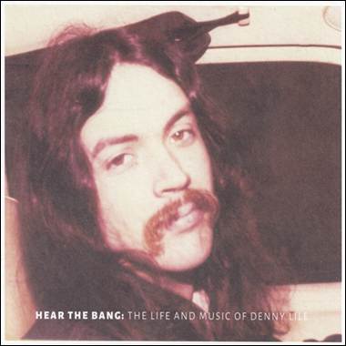 A person with long hair and a mustache

Description automatically generated