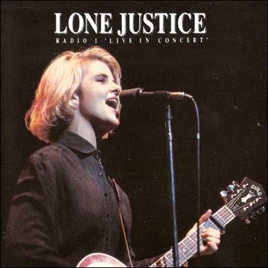 A person singing into a microphone
Description automatically generated