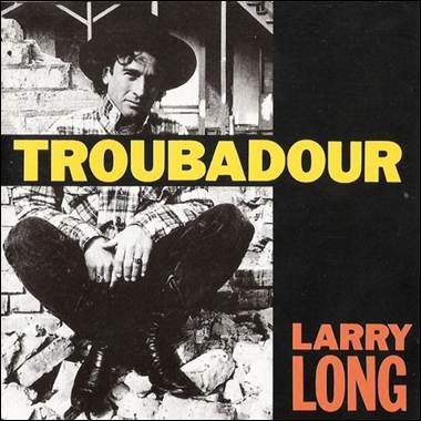 A person sitting on a brick wall
Description automatically generated