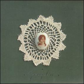 A close-up of a person's face on a lace doily
Description automatically generated