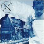 A child standing on a train track

Description automatically generated