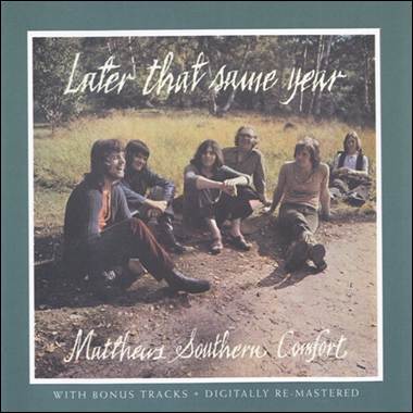 A group of people sitting on a dirt road

Description automatically generated