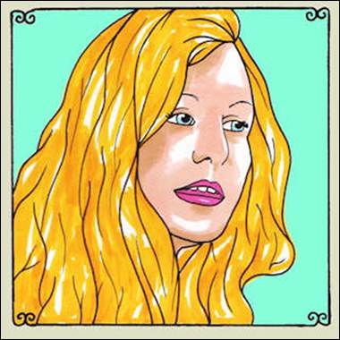 A person with long blonde hair
Description automatically generated