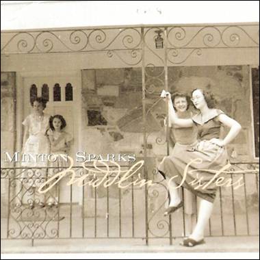 A group of women sitting on a railing

Description automatically generated