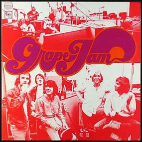 A group of men sitting in front of a cover
Description automatically generated