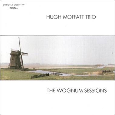 A windmill in a field
Description automatically generated