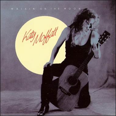 A person sitting on a guitar

Description automatically generated