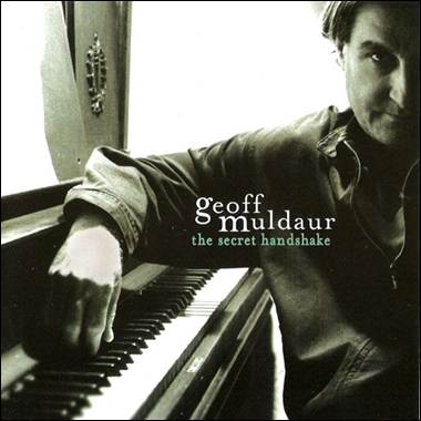 A person sitting at a piano
Description automatically generated