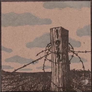 A wood post with barbed wire
Description automatically generated