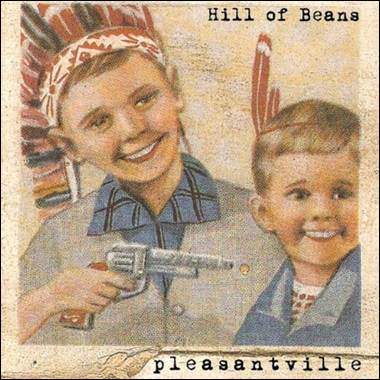 A child holding an object and smiling
Description automatically generated