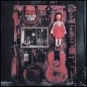 A red wooden box with a doll and a guitar

Description automatically generated